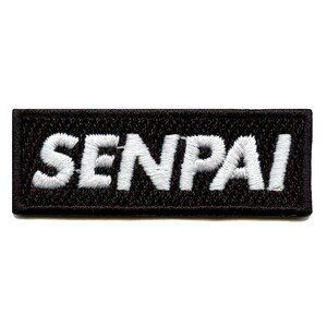 May include: Black embroidered patch with white text that reads "SENPAI".