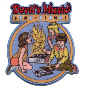 May include: A blue and yellow circular patch with the text "Devil's Music Sing-Along!" in red. The patch features an illustration of three children listening to a record player with flames coming out of it.