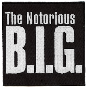 May include: Black fabric patch with white embroidered text that reads "The Notorious B.I.G."