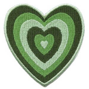 May include: Green heart-shaped patch with concentric circles of green and white embroidery.