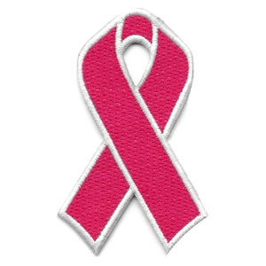 May include: Pink ribbon with a white outline. The ribbon is a symbol of breast cancer awareness.