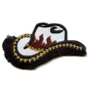 May include: Embroidered cowboy hat patch with a white crown, brown brim, and a brown and gold decorative trim. The hat features a brown flame design on the crown and a black fringe.