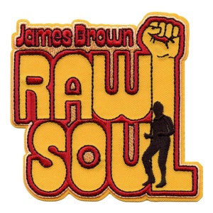 May include: A yellow and red embroidered patch with the text "James Brown Raw Soul" and a silhouette of a person dancing. The patch features a raised fist in the upper right corner.