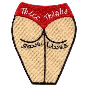 May include: Red embroidered patch with the text "Thicc Thighs Save Lives" on a beige background. The patch is shaped like a pair of thighs.