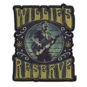 May include: A dark green and gold embroidered patch with the text "Willie's Reserve" and a silhouette of a person playing a guitar.