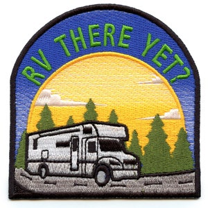 May include: Embroidered patch featuring a white RV driving on a road with green trees and a yellow sun in the background. The text "RV THERE YET?" is in green letters on a blue background.