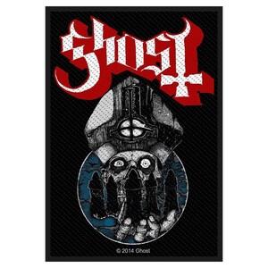 May include: A black and white embroidered patch with the word "Ghost" in red lettering. The patch features a skull wearing a bishop's hat and a hand holding a globe with figures in robes.