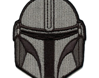 May include: A gray and black embroidered patch of a Mandalorian helmet.
