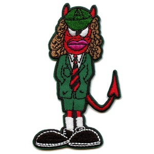 May include: Red devil cartoon character wearing a green suit, a red and black striped tie, and a green hat with a white symbol. The character has a red tail and black shoes.