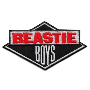 May include: A black and silver diamond-shaped patch with the words "BEASTIE BOYS" embroidered in red and white.