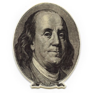 May include: A close-up of a brown and white embroidered patch featuring a portrait of Benjamin Franklin. The patch is oval-shaped and has a banner at the bottom that reads "FRANKLIN".