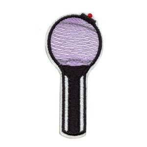 May include: Purple and black embroidered iron-on patch of a light stick with a red button on top.
