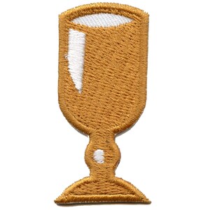 May include: A gold-colored embroidered patch of a goblet with a white interior.