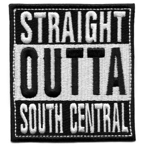 May include: Black and white embroidered patch with the words "STRAIGHT OUTTA SOUTH CENTRAL". The text is in a bold, blocky font, with the words "OUTTA" in a larger font size. The patch has a black border with white stitching.