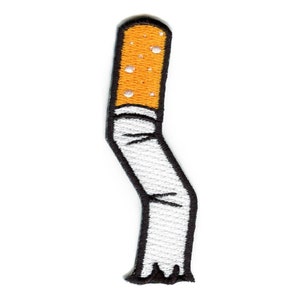 May include: A white and orange embroidered patch of a cigarette with a black outline.