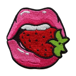 May include: Embroidered iron-on patch of a pink mouth biting into a red strawberry with green leaves.