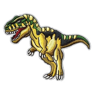 May include: A yellow and green embroidered dinosaur patch. The dinosaur is standing on its hind legs with its mouth open and teeth showing. The patch is perfect for adding a fun and whimsical touch to any project.