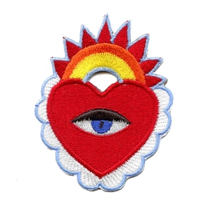 May include: Red heart-shaped embroidered patch with a blue eye and a rainbow above it. The heart is surrounded by a white cloud with a blue outline.