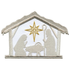 May include: A white embroidered patch depicting the nativity scene with a gold star above the manger. The figures of Mary, Joseph, and the baby Jesus are in a simple silhouette style.