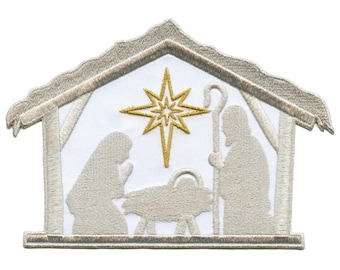 May include: A white embroidered patch depicting the nativity scene with a gold star above the manger. The figures of Mary, Joseph, and the baby Jesus are in a simple silhouette style.