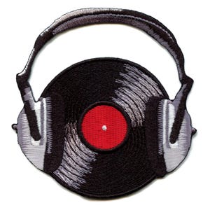 May include: A black vinyl record with a red center label, inside a pair of gray headphones. The headphones are embroidered in a vintage style.