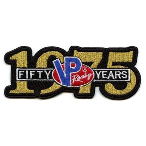 May include: A gold and black embroidered patch with the text "1975 FIFTY YEARS" and a red, white, and blue VP Racing logo.