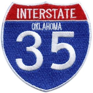 May include: A blue and red interstate highway sign with the text "INTERSTATE" and "OKLAHOMA" and the number "35" in white.