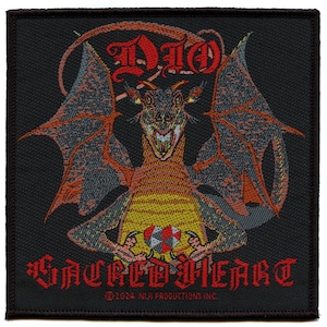 May include: A black embroidered patch featuring a red dragon with yellow and orange wings. The dragon is holding a red and black sphere. The text "DIO" is above the dragon and "SACRED HEART" is below the dragon. The text "©2004 NIJ PRODUCTIONS INC." is at the bottom of the patch.