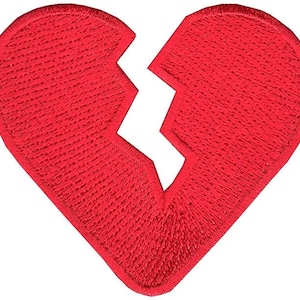 May include: A red felt heart patch with a crack down the middle, symbolizing a broken heart.