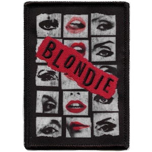 May include: Black and white patch with a red band that says "BLONDIE" across it. The patch features a grid of images of a woman's eyes and lips.