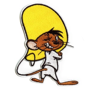 May include: An embroidered iron-on patch featuring a cartoon character with a yellow hat, brown fur, and a white shirt. The character is walking and has a mischievous expression.