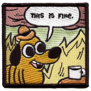 May include: A yellow dog wearing a brown hat sits in a cartoon panel with a speech bubble that says "This is fine." The dog has large, wide eyes and a panicked expression. The dog is sitting in front of a cup of coffee and a fire is burning behind the dog.