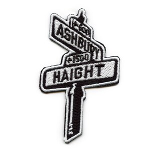May include: Black and white embroidered patch with the words "Haight" and "Ashbury" on street signs.