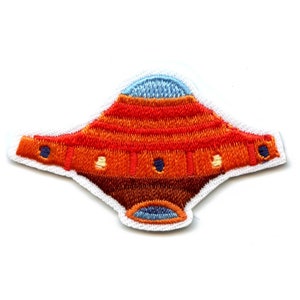 May include: An orange and blue embroidered patch depicting a flying saucer. The saucer has a rounded top and a flat bottom. The patch is ideal for adding a touch of whimsy to any project.