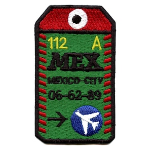 May include: Green luggage tag with red and white stitching. The tag has the text "MEX" in black, "MEXICO CITY" in white, "112 A" in yellow, and "06-62-89" in white. A blue circle with a white airplane is in the bottom right corner.