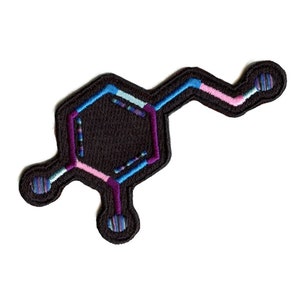 May include: A black embroidered patch depicting the chemical structure of dopamine, a neurotransmitter associated with pleasure and reward. The patch features a hexagonal ring with a side chain, all outlined in colorful thread.