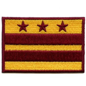 May include: An embroidered patch featuring the flag of Washington, D.C. The flag is yellow with three red horizontal stripes and three red five-pointed stars in the top left corner.