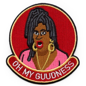 May include: Embroidered iron-on patch featuring a cartoon woman with large hoop earrings and a pink shirt. The text "OH MY GOODNESS" is written in a yellow arc around the woman.