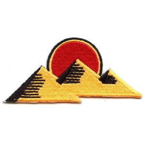 May include: Yellow embroidered patch with a red sun setting behind three black and yellow mountains.