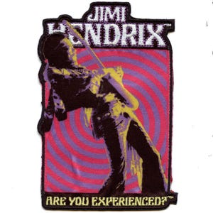 May include: A purple, pink, and yellow embroidered patch featuring a silhouette of Jimi Hendrix playing a guitar with the text "Jimi Hendrix" and "Are you experienced?"