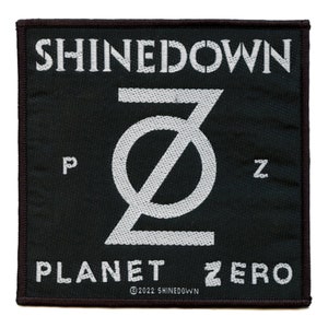 May include: Black and white embroidered patch with the band name "Shinedown" and the album title "Planet Zero" with a stylized "Z" logo.