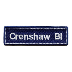 May include: A blue embroidered patch with white stitching that reads "Crenshaw Bl".