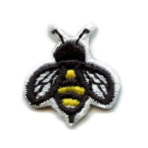 May include: A small embroidered bee patch with black and white wings and a yellow and black striped abdomen.