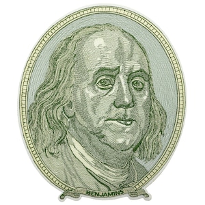 May include: A close-up of Benjamin Franklin's portrait from a US dollar bill, with the word "BENJAMINS" printed on a ribbon at the bottom.