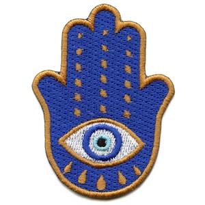 May include: Blue and gold embroidered hamsa hand with a white and blue evil eye in the center.