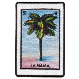 May include: Embroidered patch featuring a palm tree design. The patch has a rectangular shape with a white border and a black outline. The design includes the number "51" at the top and the words "LA PALMA" at the bottom. The palm tree has green and brown leaves.