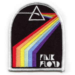 May include: A black and white embroidered patch with a rainbow and the text "PINK FLOYD" in white.