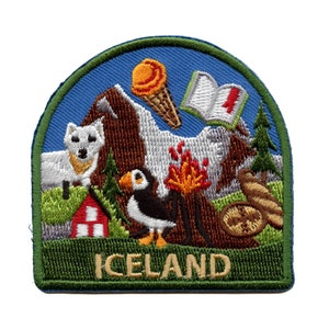 May include: Embroidered patch with a green border and the word "ICELAND" in white. The patch features a white polar bear, a red and white house, a puffin, a volcano with orange flames, a book with a red number one, and an ice cream cone.
