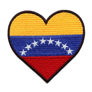 May include: A heart-shaped patch with the Venezuelan flag. The flag is yellow, blue, and red with eight white stars in the blue band.