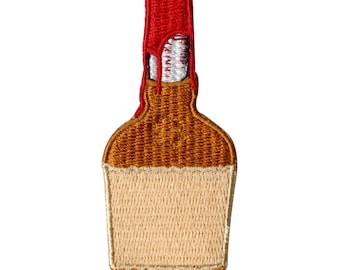 May include: Embroidered patch of a brown glass bottle with a red top. The bottle has a white label.